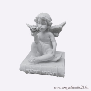 Angyal ülő könyvön, kristálygömbbel